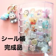 料*長様 完成したシール帳とキャラクターシール