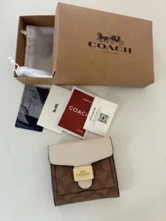 コーチ二つ折り財布美品ブラウンホワイトのサムネイル