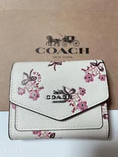 COACH 花柄 ホワイト　二つ折り財布 レディース