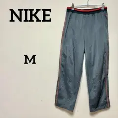 NIKE ナイキ トラックパンツ ジャージパンツ グレー×オレンジライン メンズ