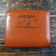 スヌーピー エンボス 二つ折り財布 オレンジ