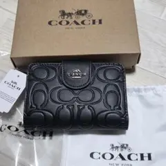 COACH 二つ折り財布 新品　ブラック エンボスロゴのサムネイル