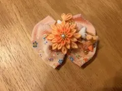 花飾り付きオレンジリボンバレッタ