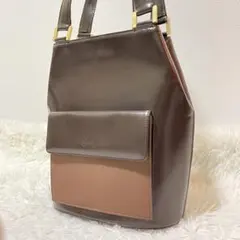 イヴ・サンローラン　ハンドバッグ　ブラウン　カーフレザー　ロゴ刻印　ゴールド金具
