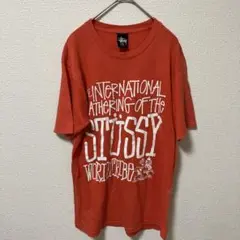 ステューシー　STUSSY オレンジ プリント Tシャツ S