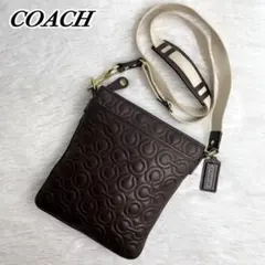 コーチ　ほぼ未使用！　ショルダーバッグ　オプアート　ロゴエンボス加工　総柄　本革 コーチ ショルダーバッグ スクエア オプアート 総柄 ロゴ型押し