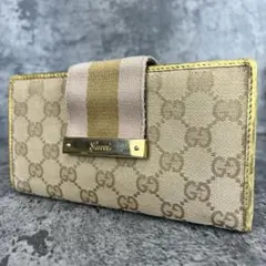 GUCCI GGキャンバス×レザー 長財布 ゴールド金具 リボンデザイン