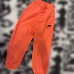 Nike オレンジ ロングパンツ