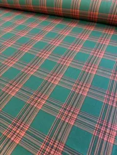 緑とオレンジのチェック柄の綿生地