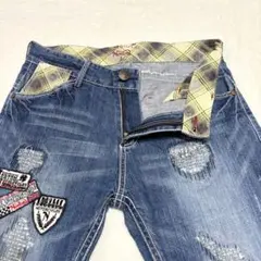 ノートン ストレート デニムパンツ ダメージ加工 刺繍パッチ ヒゲ ハチノス Lのサムネイル