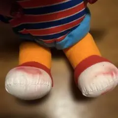 ストライプシャツのオレンジ人形