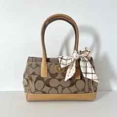 正規品【COACH】コーチ シグネチャー ハンドバッグ ターンロック ビンテージのサムネイル