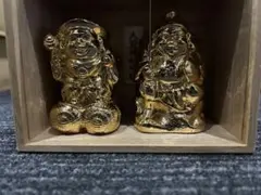金色の福助と布袋の置物