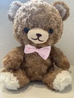 茶色のリボン付きぬいぐるみ
