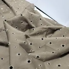 B ダメージ加工　112×1ｍ　中肉綿　つや少し有　暗カーキ系 　穴開き加工