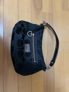 COACH ブラック円形模様ハンドバッグ