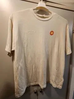 ジョナスクレアッソンのクリーム色 太陽刺繍 Tシャツ(リバーシブル)
