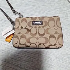 COACH ブラウンロゴポーチ 新作