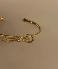 kate spade NEW YORK バングル リボン ゴールドのサムネイル