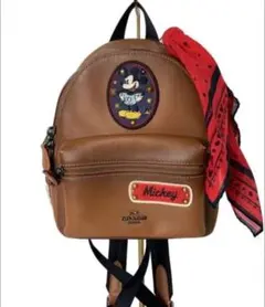 COACH ディズニーコラボ ビンテージレザーリュック バンダナチャーム付 