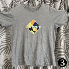 F.C.R.B. Bristol Tシャツ グレーのサムネイル