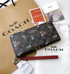 【新品タグ付】COACH 長財布 シグネチャー 花柄 リストレット付きのサムネイル