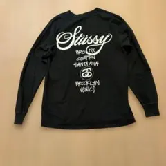 『 ステューシー』両面プリント長袖Tシャツ /カットソーブラックメンズサイズM