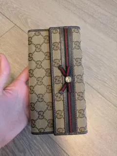 GUCCI 二つ折り財布 GGキャンバス シェリーライン リボン