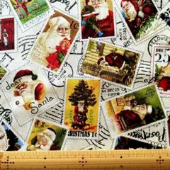 切手サンタ柄 クリームホワイト110cm Quilting Treasures