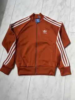adidas originalsトラックジャケット オレンジ