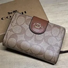 【未使用箱付き】COACH 二つ折り財布 シグネチャー ブラウンのサムネイル