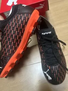 PUMA サッカースパイク NETFIT ブラック/オレンジ 27cm - メルカリ