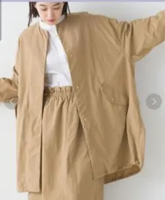 【タグ付き】OMNES 撥水加工ナイロンノーカラー 裾ドローコードブルゾン