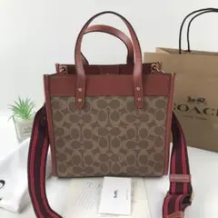新品 COACH デンプシー トート22 シグネチャージャカード