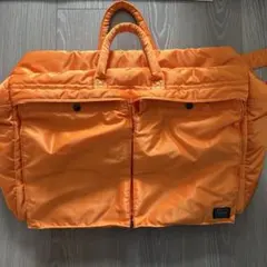 ポーター 80周年記念品 タンカー トラベルバッグ オレンジ