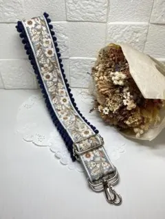 【インド刺繍リボン】花柄刺繍　水色リボン紺色ポンポン付　携帯ショルダーストラップ