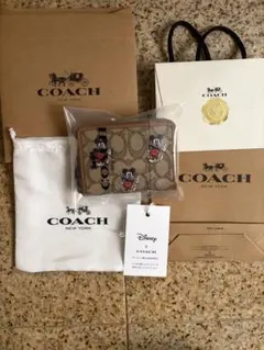 DISNEY X COACH ミッキー 二つ折り財布　新品未使用のサムネイル