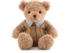 ベージュのセーターを着たクマのぬいぐるみ