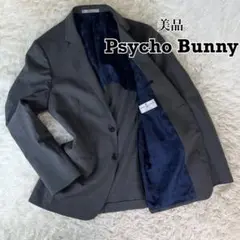 美品 Psycho Bunny テーラードジャケット 裏地ロゴ総柄 背抜き 2B