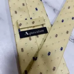 アクアスキュータム ネクタイ イエロー 総柄 ふくろう シルク