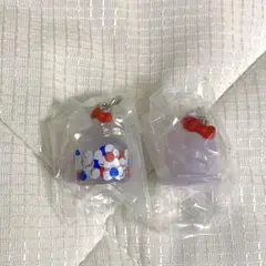 モンチッチ　ハローキティ　めじるしアクセサリー 2点セット