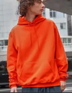 Champion オレンジ フード付きパーカー