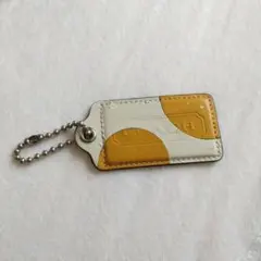 【即購入可】COACH レザー チャーム イエロー ホワイト【匿名発送】