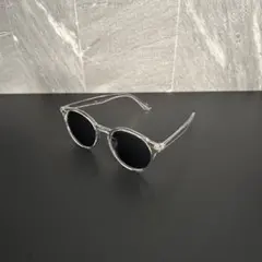 クリアフレーム ブラックレンズ ラウンドサングラス