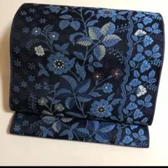西陣織九寸名古屋帯　弥栄織物（株）濃紺地青い花柄