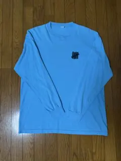 UNDEFEATED ロングスリーブTシャツ ライトブルー Lサイズのサムネイル