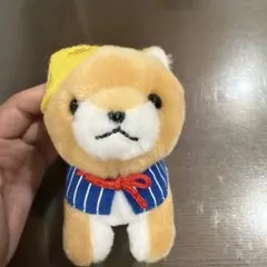 柴犬 ぬいぐるみ 黄色い帽子 青いストライプの襟巻き