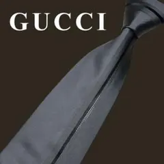 GUCCI グレー無地 モード系 シルクネクタイ 洗練ミニマル