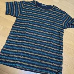 mercibeaucoup メルシーボーク M L相当 ロゴ総柄 Tシャツのサムネイル