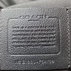 COACH ブラックレザー リュックサック。ユニセックス。